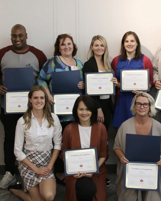 Graduating class with certificates of completion, The Botox Course